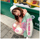 Girl Wearing Kawaii Pastel Skeleton Heart Jacket