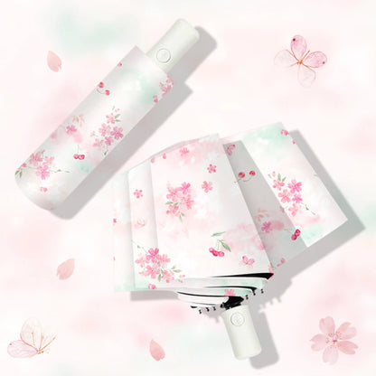 Handheld Pretty Cherry Blossoms Umbrella with floral design on a light pink background