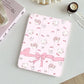 tablet case with cute animal and bow pattern on a light surface