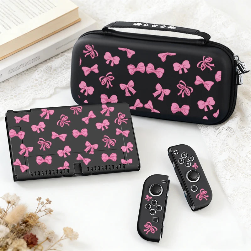 This image is showing the Cute Pink Bows Switch Case black edition on a white surface next to a book.