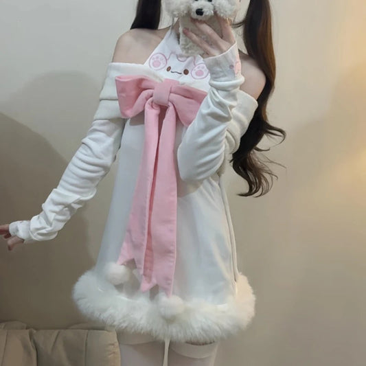 Person wearing a white outfit with a pink bow and holding a cell phone