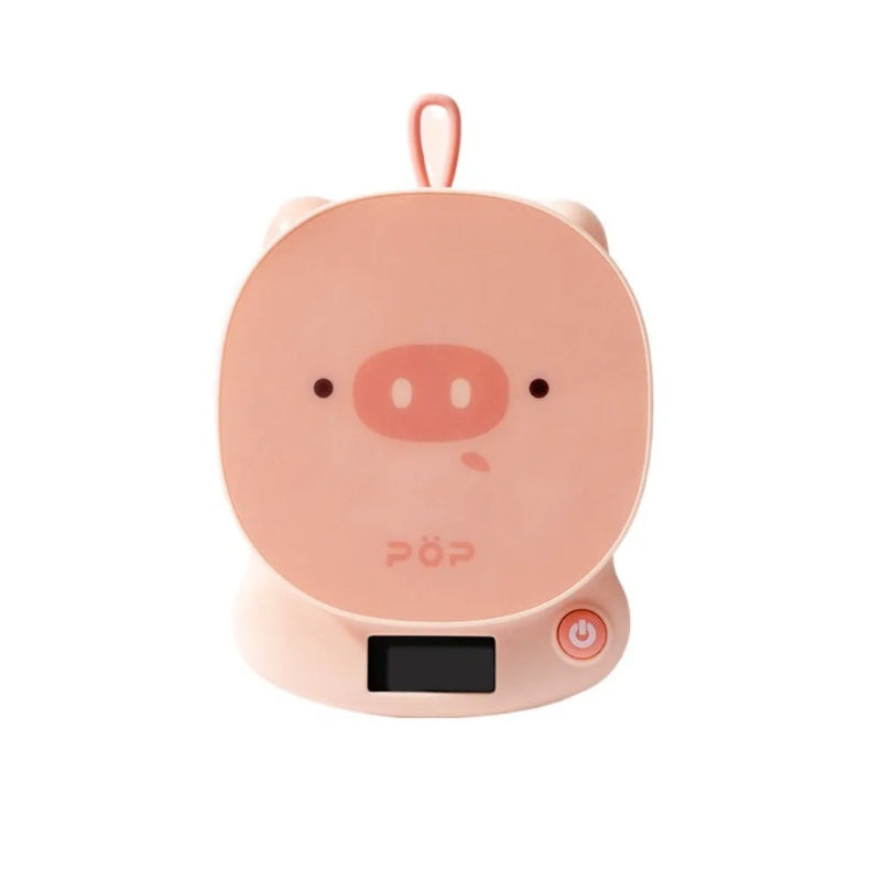Pink pig-shaped scale with a power button on a white background
