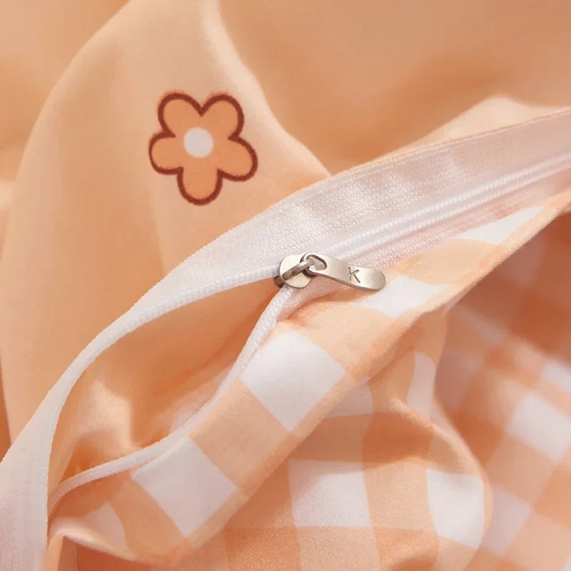Close-up of a checkered fabric with a zipper and a flower design on an orange background