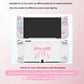 White gaming console with pink bow design on a light pink background