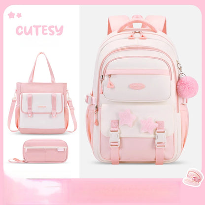 Set of pink and white bags with 'CUTESY' branding on a pink gradient background