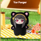Plush toy resembling a character named Yor Forger on a picnic blanket with food and drinks.
