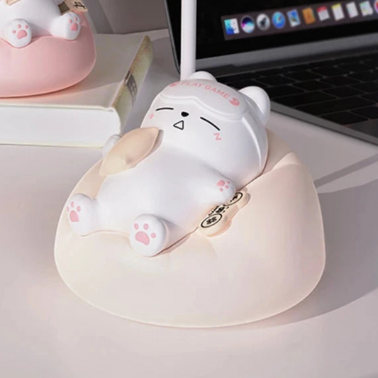 Cute cat night light with a laptop on a desk
