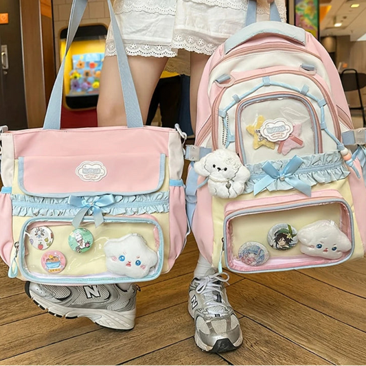 Person holding two decorative bags with various embellishments in an indoor setting.
