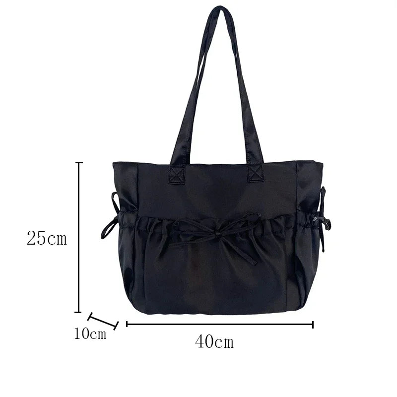 Black tote bag with measurements on a white background