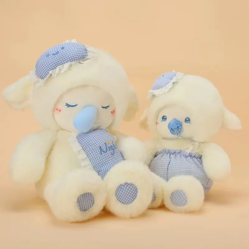 Two plush lamb toys with blue accents on a beige background