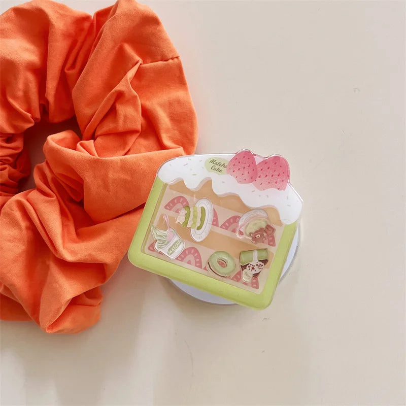 Kawaii Matcha Cake Phone Grip, this displays the grip by itself as you can buy it by itself to accessorize your phone.