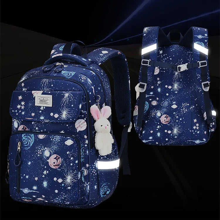 Two blue backpacks with reflective strips on a dark background