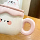 Kawaii Animal Pudding Ceramic Mug  in white and pink on a countertop 