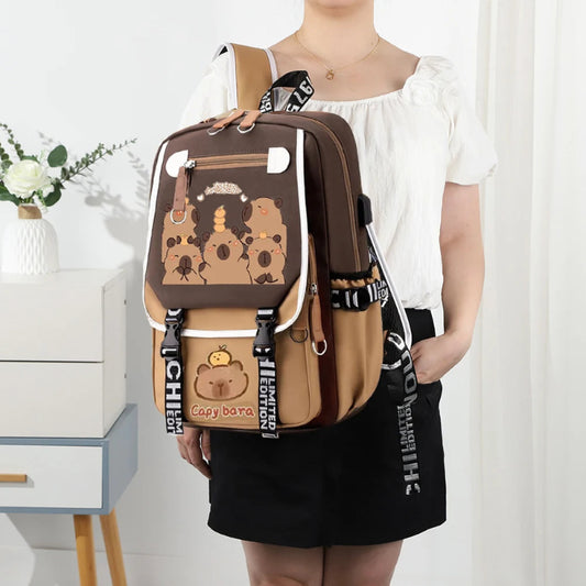 Person wearing a brown and beige backpack with capybara  designs in a room setting.