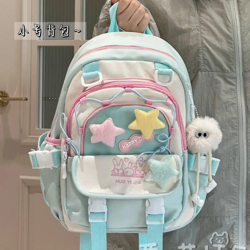 Kawaii backpack with multiple pockets being held by a person