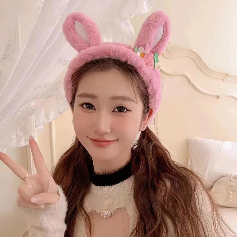 Person wearing a pink bunny headband in a bedroom setting