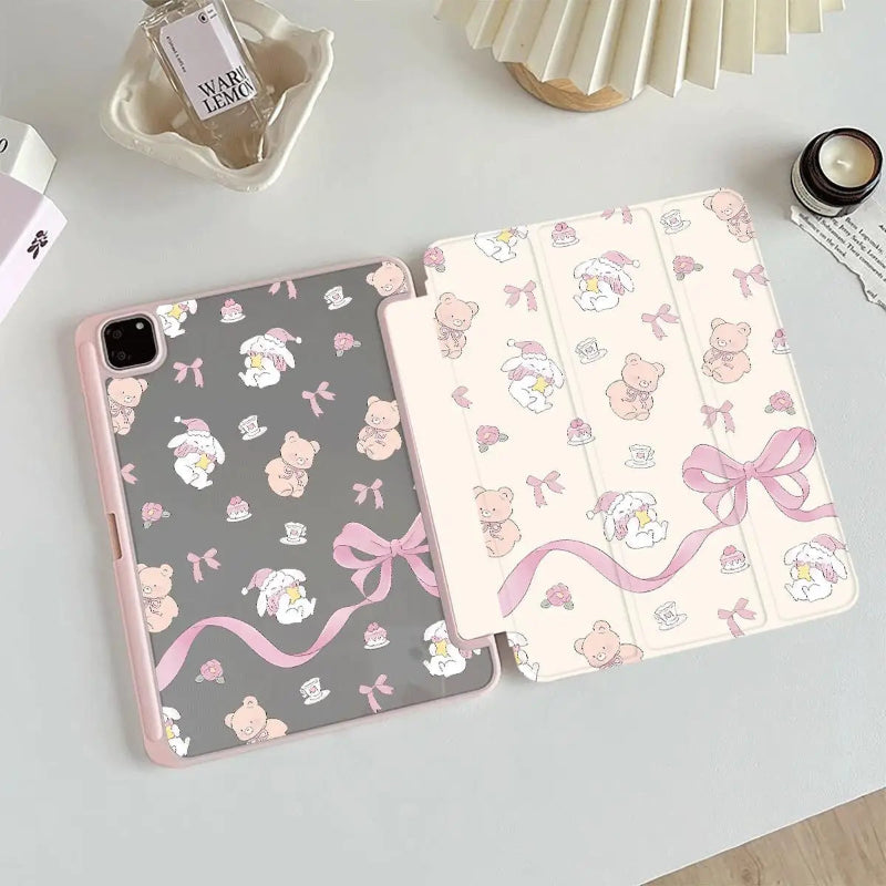 tablet case with teddy bear and bow pattern on a light surface.
