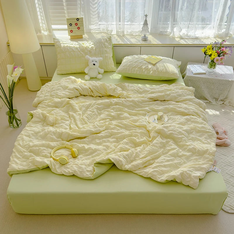 Green seersucker duvet set displayed on bed.