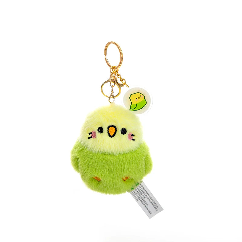 kawaii yellow and green bird plushie keychain on a white background
