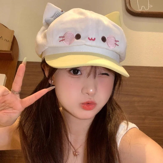 Person wearing a cute cartoon hat with cat ears, making a peace sign.