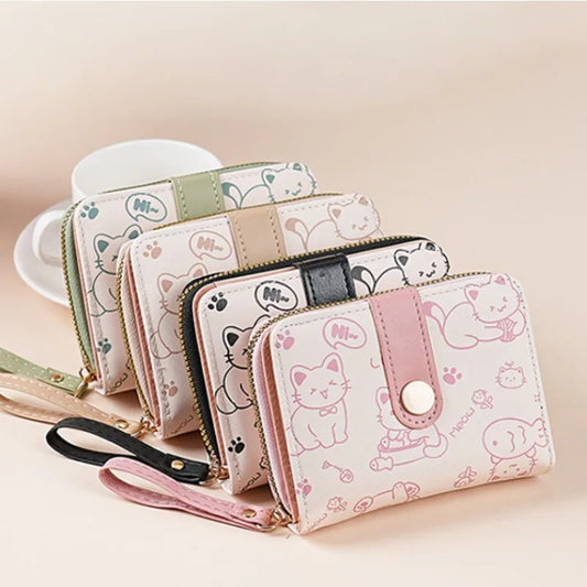 Set of kawaii cat-themed wallets with different designs on a light background