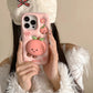 Rear view of Kawaii Peach iPhone Case being held by a woman. 