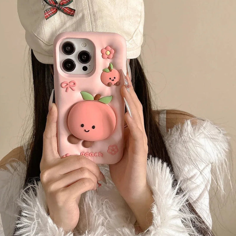 Rear view of Kawaii Peach iPhone Case being held by a woman. 
