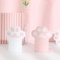 Pink and white kawaii paw print bookends on a light pink background