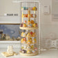 A clear cylindrical rotating display stand with multiple cream-colored shelves, filled with small pastel character figurines. White dashed measurement lines and text labels indicate dimensions: 14.