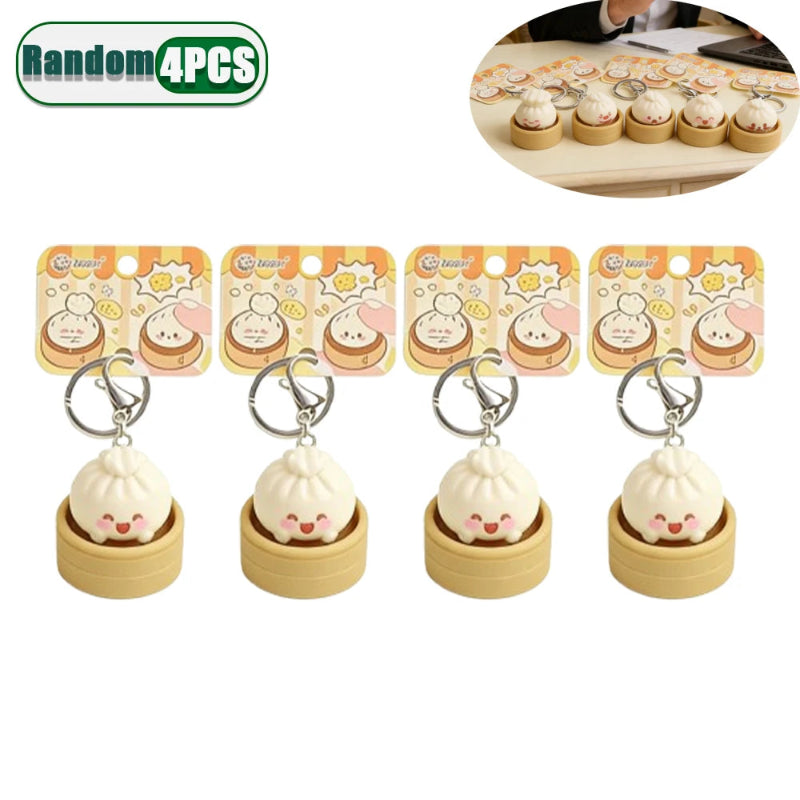 Set of four cute keychains with packaging on a white background