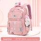 Pink backpack with teddy bear plush toy on a light pink background