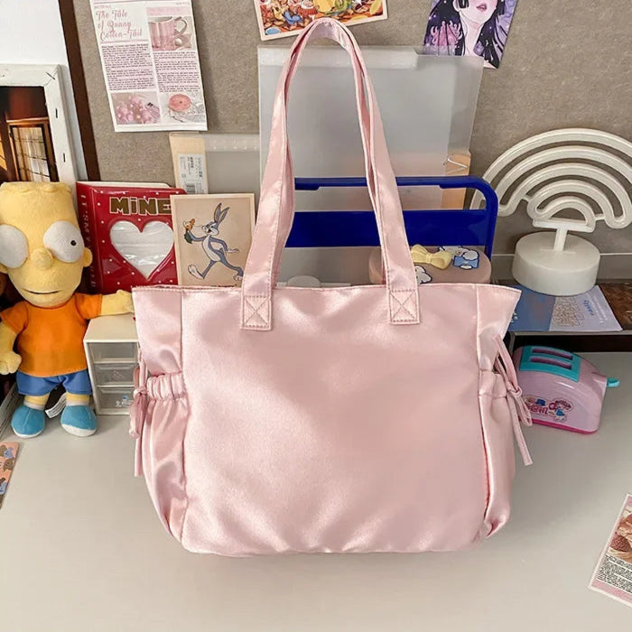 Pink Pastel Shoujo Tote Bag resting on a desk