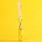 Yellow handheld fan with duck design and keychain on a yellow background