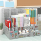 Graey desk organizer with books, stationery, and decorative items on a tiled floor.