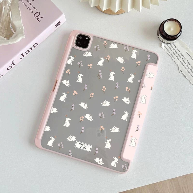Tablet case with rabbit and flower pattern on a light surface