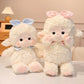 Pastel Kawaii Bunny and Lamb Plushies on a bed 