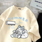Beige t shirt with cartoon cat and air conditioner design on a textured surface