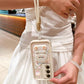 This woman is demonstrating the wrist strap that comes with the  Kawaii Cuties Samsung Phone Case. 