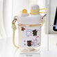  cute water bottle with cartoon designs held by hands against a blurred background. displaying the measurements of it.