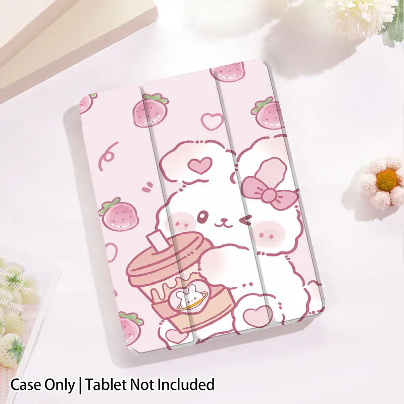 kawaii Strawberry Bunny & Coffee iPad Case, this case depicts a bunny winking while holding a coffee in its paws, with strawberries raining down, the main color is pastel pink with a white rabbit. this case is displayed on a white desk top.