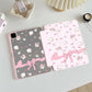 Kawaii tablet case with cute animal and bow pattern on a light surface.