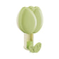 Green wall hook with leaf design on a white background