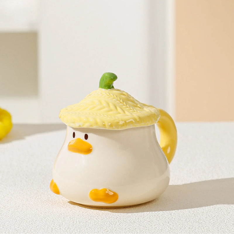 Kawaii Duck Mug with yellow Lid on countertop