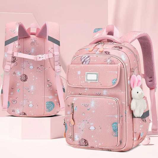 Pink backpack with decorative elements on a pink background