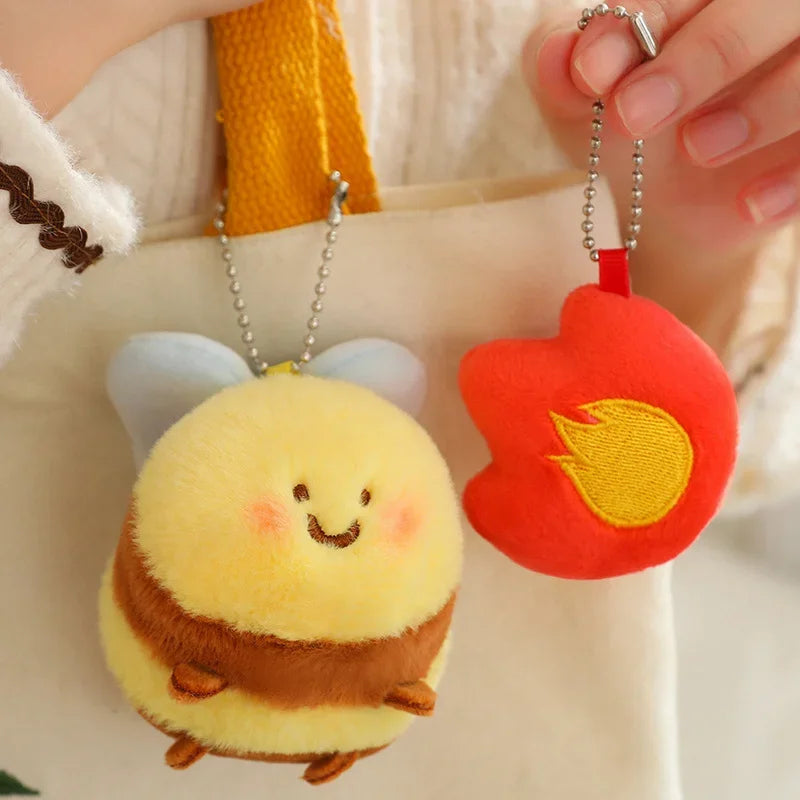 woman holding a kawaii bee plushie keychain