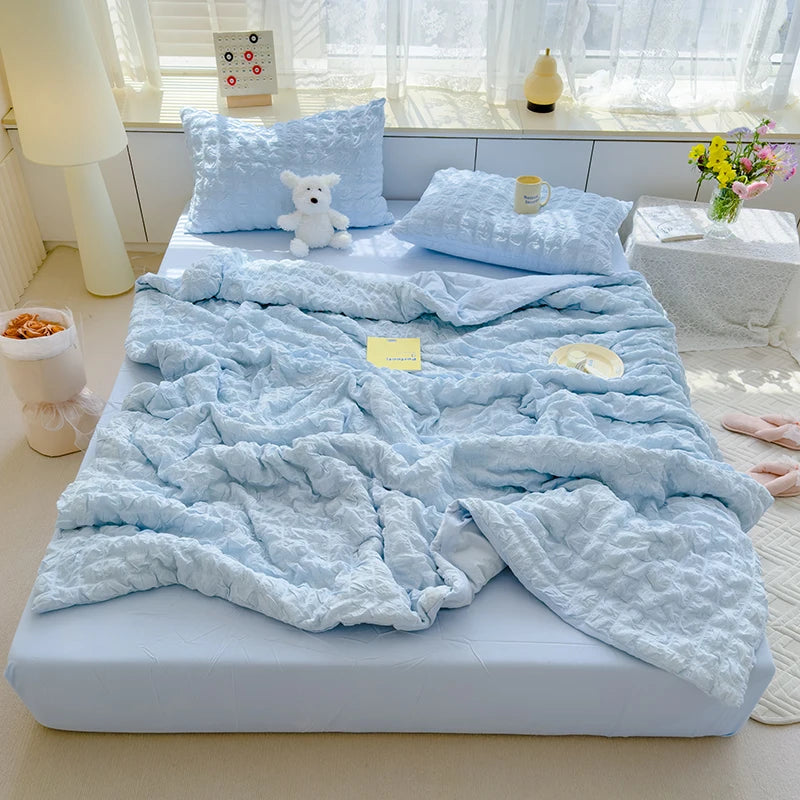 Blue seersucker duvet set displayed on bed.