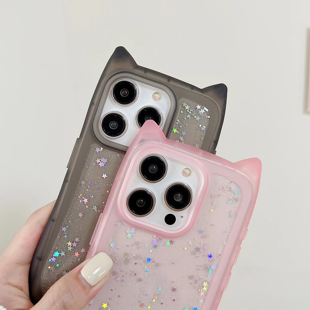 Two phone cases, one gray and one pink, held by a hand against a light background.