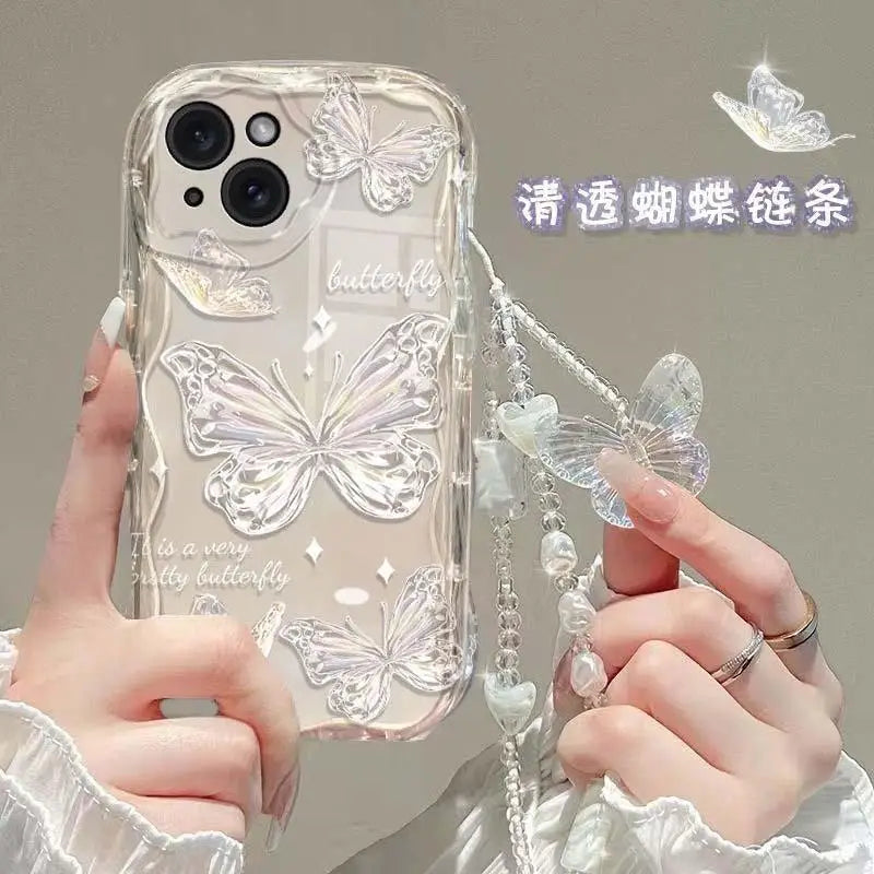 Clear phone case with butterfly designs held by a person
