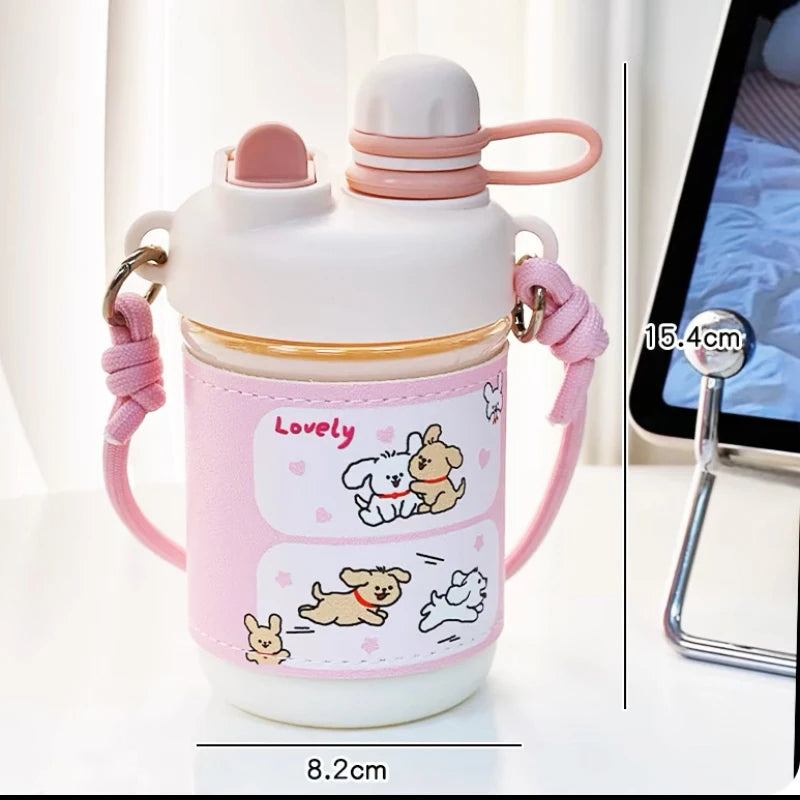 Pink water bottle with cartoon designs and measurements on a white background