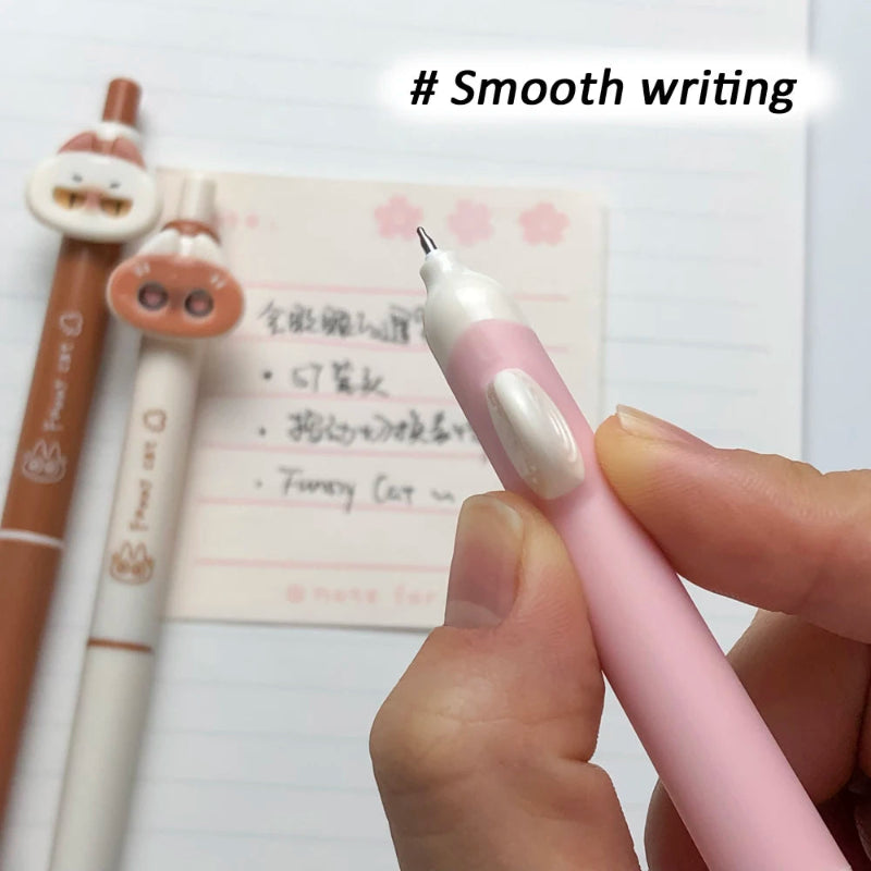 Pink cute sassy cat pen being held with a background of a notepad and another pen, with '# Smooth writing' text.